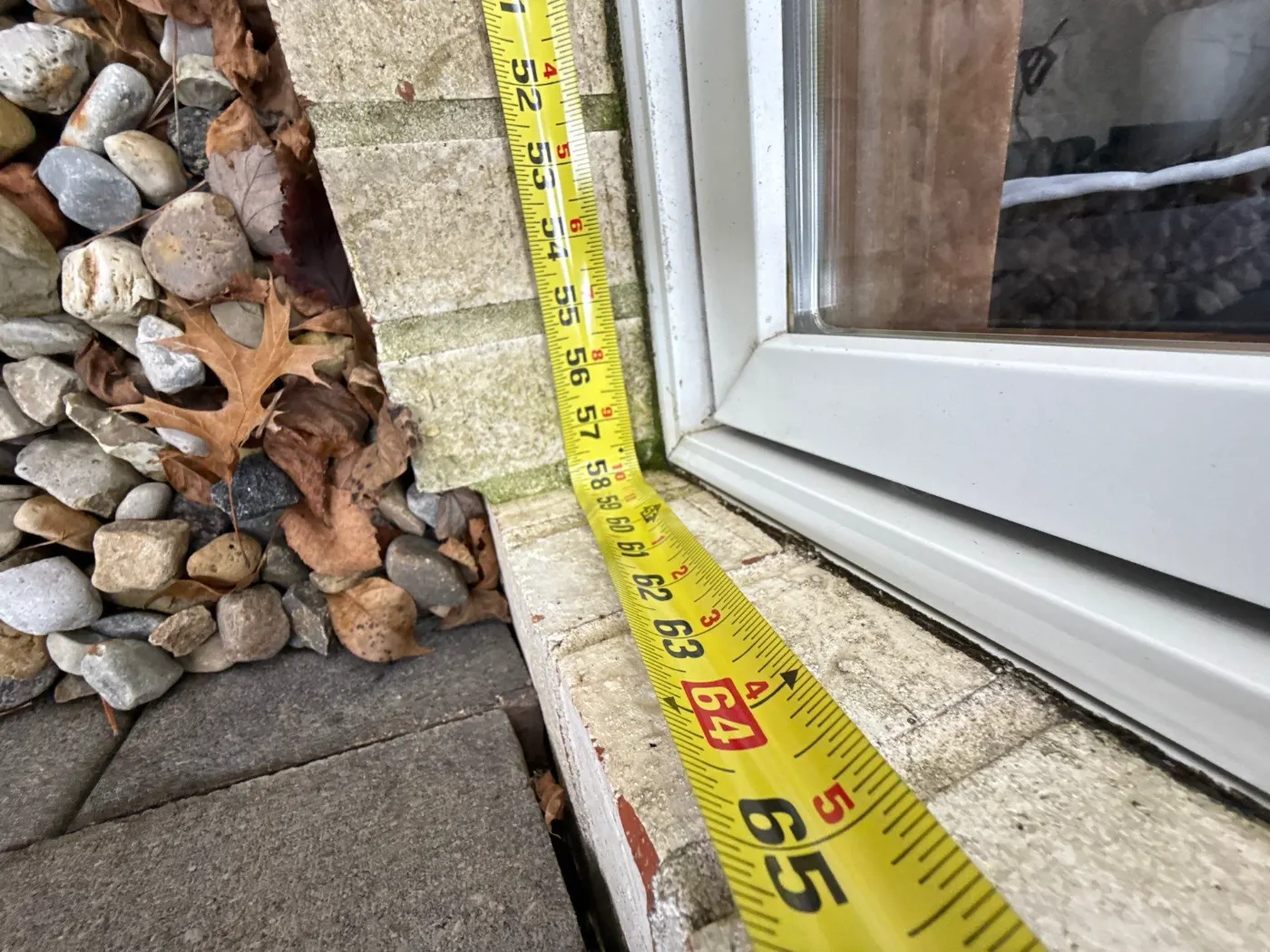 Storm-damaged window documented in Rushville